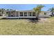 Spacious backyard featuring a screened-in lanai perfect for enjoying outdoor living at 501 Dona Dr, Nokomis, FL 34275