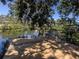 Newly constructed wooden dock with a bench, providing a peaceful waterfront retreat at 501 Dona Dr, Nokomis, FL 34275