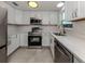 Updated kitchen featuring stainless steel appliances, quartz countertops and white cabinetry at 501 Dona Dr, Nokomis, FL 34275