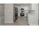 Modern kitchen with stainless steel appliances, white cabinets, and quartz countertops at 501 Dona Dr, Nokomis, FL 34275