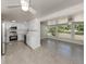 Open concept kitchen with stainless steel appliances and a sunroom overlooking the backyard at 501 Dona Dr, Nokomis, FL 34275