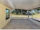 Inviting screened lanai offering views of the expansive backyard and mature trees at 501 Dona Dr, Nokomis, FL 34275