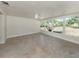Bright sunroom featuring neutral paint, large windows offering backyard views and tile floors at 501 Dona Dr, Nokomis, FL 34275