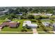 Aerial view of waterfront home highlighting its location, spacious yard, and proximity to the water at 506 Buena Vista Dr, Nokomis, FL 34275