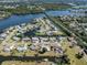 Charming waterfront home offers access to the Gulf, private boat dock, and a lush green lawn at 506 Buena Vista Dr, Nokomis, FL 34275