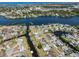 Scenic aerial view of a waterfront neighborhood with winding canals and beautiful waterways at 506 Buena Vista Dr, Nokomis, FL 34275