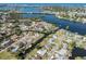 Neighborhood aerial view showcases waterfront homes along winding canals and a waterway at 506 Buena Vista Dr, Nokomis, FL 34275