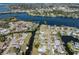 Neighborhood aerial view showing waterfront homes along winding canals and a waterway at 506 Buena Vista Dr, Nokomis, FL 34275