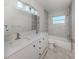 Modern bathroom featuring double sinks, sleek vanity, tiled shower, and contemporary fixtures at 506 Buena Vista Dr, Nokomis, FL 34275