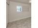 A bright room with light tile flooring, closet and window at 506 Buena Vista Dr, Nokomis, FL 34275