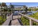 Private boat dock and lift on a calm canal, perfect for boating enthusiasts and waterfront living at 506 Buena Vista Dr, Nokomis, FL 34275