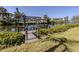 Waterfront dock with boat lift and scenic canal view, perfect for boating enthusiasts at 506 Buena Vista Dr, Nokomis, FL 34275