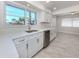 Bright kitchen features stainless steel appliances, white cabinets and lots of counterspace at 506 Buena Vista Dr, Nokomis, FL 34275
