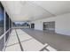 Expansive lanai with screened openings and neutral flooring; ideal for relaxation and entertaining at 506 Buena Vista Dr, Nokomis, FL 34275