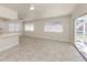 Bright, open living area with sliding doors for indoor/outdoor flow at 506 Buena Vista Dr, Nokomis, FL 34275