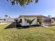 A well-maintained home with a screened patio area and landscaping at 506 Buena Vista Dr, Nokomis, FL 34275