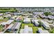 An aerial view highlights a large neighborhood by the water, with well-maintained lawns, streets, and diverse home styles at 508 Blackburn Blvd, North Port, FL 34287