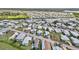 An elevated view shows a community with homes and tree-lined streets adjacent to waterways, offering a picturesque and serene setting at 508 Blackburn Blvd, North Port, FL 34287