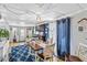 The dining room with laminate flooring and modern light fixture at 508 Blackburn Blvd, North Port, FL 34287