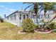 Charming single-story home featuring a well-manicured lawn and mature palm trees at 508 Blackburn Blvd, North Port, FL 34287