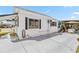 Exterior angle of a single-story home featuring awnings, and a driveway leading to a covered carport at 508 Blackburn Blvd, North Port, FL 34287