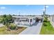 Inviting single-story home with a covered patio, awning, and a long driveway at 508 Blackburn Blvd, North Port, FL 34287