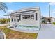 Single-story home boasts a neat exterior with awnings, and a driveway leading to a covered carport at 508 Blackburn Blvd, North Port, FL 34287