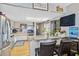 The kitchen offers stainless appliances, a breakfast bar, and laminate flooring at 508 Blackburn Blvd, North Port, FL 34287