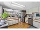 Bright kitchen boasts stainless appliances, laminate floors, and an open floor plan at 508 Blackburn Blvd, North Port, FL 34287