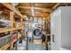 Functional laundry room with washer, dryer, storage shelves, and work area at 508 Blackburn Blvd, North Port, FL 34287