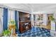 Living room with laminate floors, large television, and bright natural light at 508 Blackburn Blvd, North Port, FL 34287