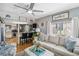 Open-concept living room flows into a modern kitchen with bar seating and stylish decor, ideal for entertaining at 508 Blackburn Blvd, North Port, FL 34287