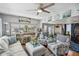 Inviting living room featuring a comfortable sofa, patterned armchairs, and coastal-inspired decor for a relaxed atmosphere at 508 Blackburn Blvd, North Port, FL 34287