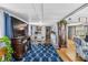 Open concept living/dining room with laminate flooring and bright lighting at 508 Blackburn Blvd, North Port, FL 34287