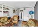 Comfortable covered porch with wicker chairs, decorative signs, and coastal accents, creating a cozy and inviting space at 508 Blackburn Blvd, North Port, FL 34287