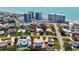 Aerial view highlighting a cozy home near the beach featuring nearby resorts, and a clear sunny sky at 632 Valencia Rd, Venice, FL 34285