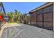 Backyard view of the screened in patio with access from the side and plenty of space for parking at 632 Valencia Rd, Venice, FL 34285