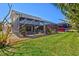 Captivating backyard with a screened in patio and a well maintained lawn, perfect for outdoor enjoyment at 632 Valencia Rd, Venice, FL 34285