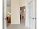 Bright, spacious bathroom with an open doorway and view of vanities and a separate shower area at 632 Valencia Rd, Venice, FL 34285