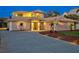 Beautiful two-story home featuring desert landscaping, well-lit driveway, and a welcoming entrance at 632 Valencia Rd, Venice, FL 34285