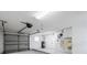 Spacious garage with high ceilings, ample lighting, and room for vehicles and storage at 632 Valencia Rd, Venice, FL 34285