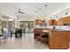 Open kitchen with a central island, breakfast bar, and seamless access to the lanai and pool area at 632 Valencia Rd, Venice, FL 34285