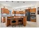 Well-equipped kitchen with granite countertops, stainless steel appliances, and a wine rack at 632 Valencia Rd, Venice, FL 34285