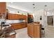 Spacious kitchen with an island, extensive cabinetry, and seamless flow to the adjacent rooms at 632 Valencia Rd, Venice, FL 34285