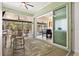Relaxing lanai with seating, overlooking a sparkling pool and lush landscaping at 632 Valencia Rd, Venice, FL 34285