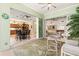 Inviting covered patio with views into the kitchen and living areas through sliding glass doors and modern furniture at 632 Valencia Rd, Venice, FL 34285