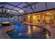 Backyard view of pool with hot tub, fire pit, and covered patio near an RV at 632 Valencia Rd, Venice, FL 34285