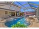 Beautiful pool and spa with outdoor kitchen, RV parking, and screened enclosure at 632 Valencia Rd, Venice, FL 34285