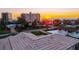 Rooftop view with a railing overlooking neighboring houses, nearby condos, and a clear sunset sky at 632 Valencia Rd, Venice, FL 34285