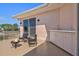 Outdoor terrace with comfortable seating, a built-in kitchenette, and a cozy fire pit for relaxation at 632 Valencia Rd, Venice, FL 34285